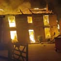 The Crooked House ablaze three years ago. Photo: Chris Green
