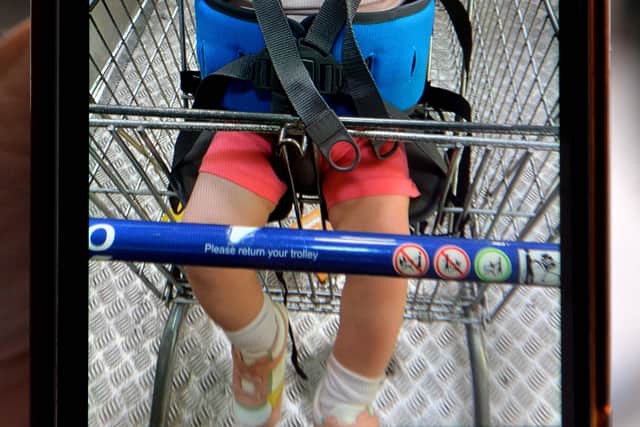 Maeve loves going shopping, but her parents often struggle to put her in standard supermarket trolleys.