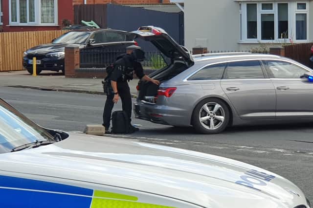 Officers begin packing away at the end of the operation