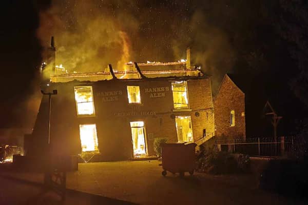 The Crooked House burning on Saturday night. Photo: Chris Green