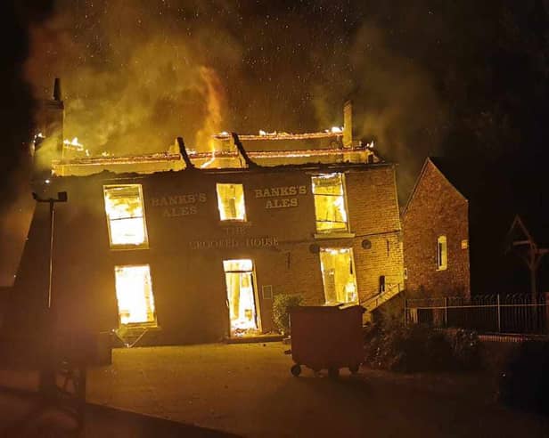 The Crooked House burning on Saturday night. Photo: Chris Green