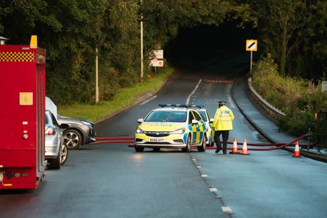 Police have closed the lane leading to the pub