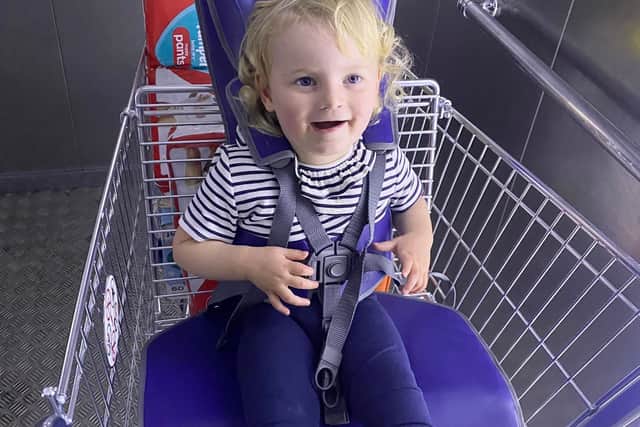 Maeve sitting in the GoTo shopping trolley at Tesco in Stourbridge.