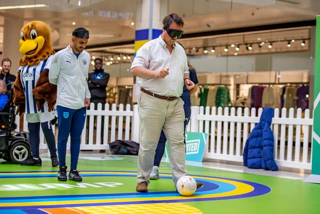 Mike Wood is put through his paces for blind football as part of the launch event