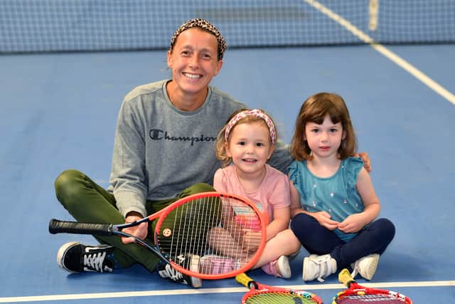 Amber Fellows, who used to coach Henry when he was two years old, is pictured with daughter Lily and Sophia Navratil