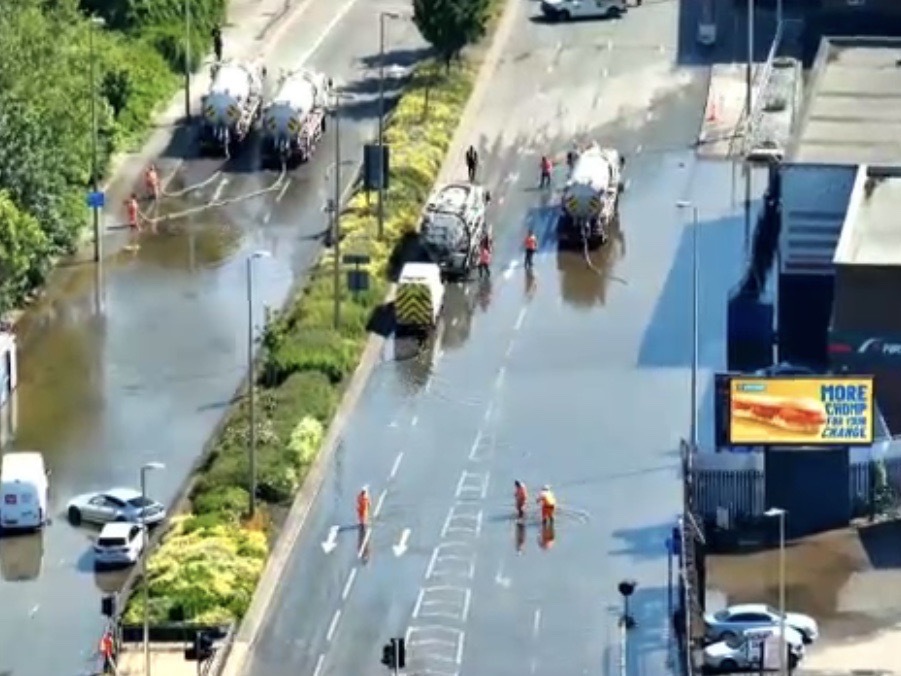 Three rescued from cars and motorists urged to avoid road due to burst ...