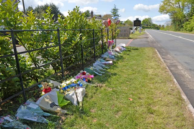 The tributes stretched along a fence next to the A456