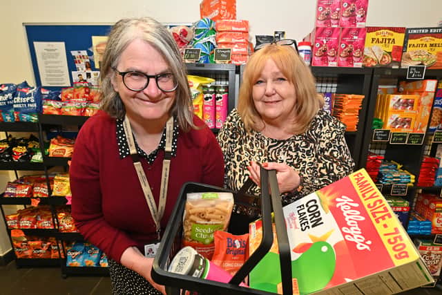Councillor Louise Miles and centre manager Denise Robins show off some of the items up for sale