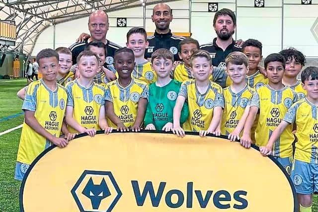 Karl Henry with his Boldmere side on a visit to the Wolves Academy – the former Molineux midfielder has helped forge links between the two clubs