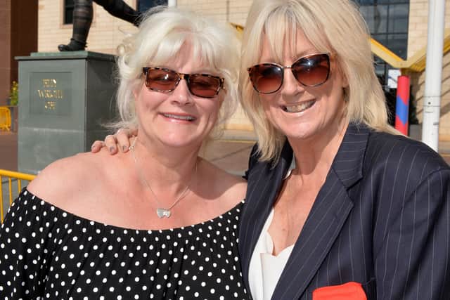 Vicky was a keen Wolves supporter. She is pictured with her sister Babette Woodham by the Billy Wright statue at Molineux