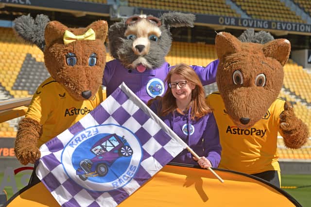 Sarah Belcher with the mascots 