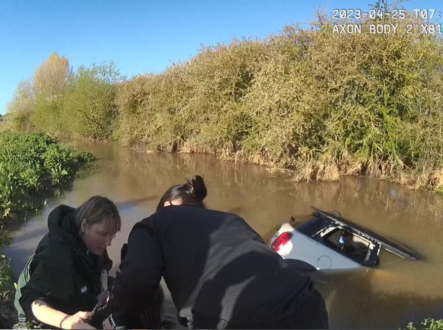 Police save woman from drowning in dramatic video shared to highlight ...