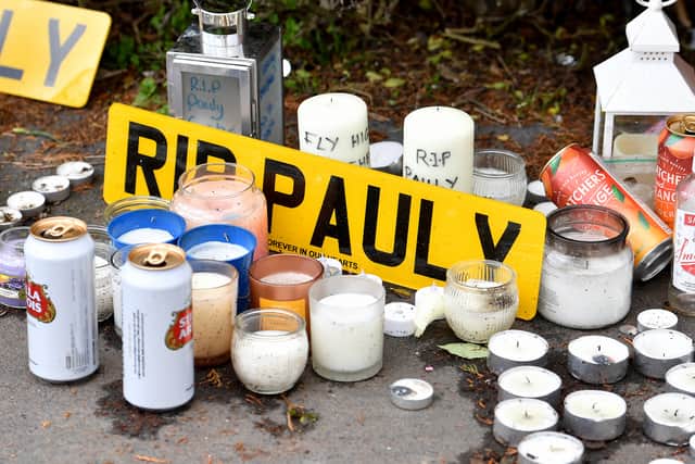 Tributes have been left at the scene of the crash in Stream Road, Kingswinford