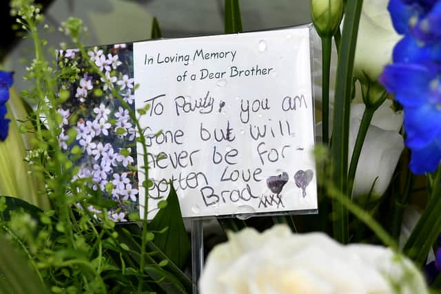 Tributes have been left at the scene of the crash in Stream Road, Kingswinford