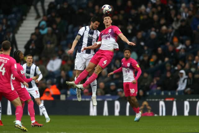 Okay Yokuslu and Matty Pearson battle for the ball in the air (Photo by Adam Fradgley/West Bromwich Albion FC via Getty Images).
