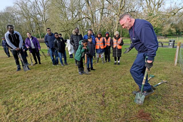 Ranger Martin Davies explains how to plant the trees