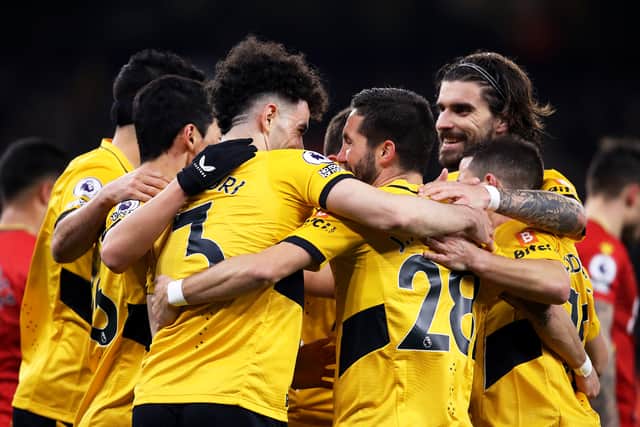 Wolves players celebrate together as a 4-0 win over Watford continues their climb (Getty)