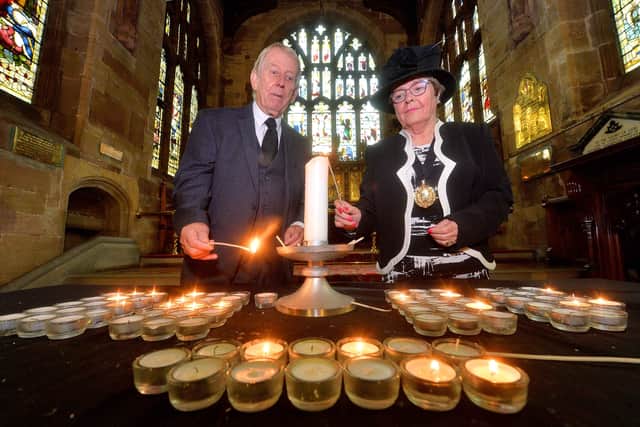Walsall Mayor Councillor Rose Martin and Deputy Mayor Councillor Chris Towe, light a candle