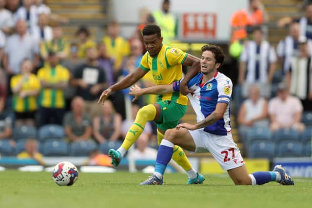 Grady Diangana of West Bromwich Albion and Lewis Travis of Blackburn Rovers during the Sky Bet Championship between Blackburn Rovers and West Bromwich Albion at Ewood Park on August 14, 2022 in Blackburn, United Kingdom. (Photo by Adam Fradgley/West Bromwich Albion FC via Getty Images).