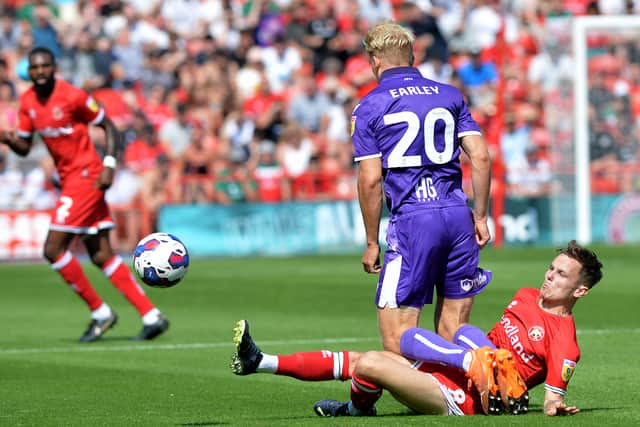 Walsall's Liam Kinsella goes in for a tackle with Stevenage's Saxon Earley