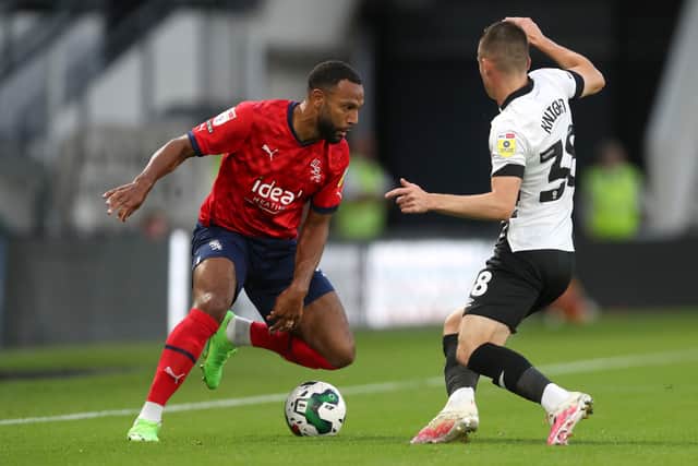 Matt Phillips of West Bromwich Albion and Jason Knight of Derby County during the Carabao Cup Second Round match between Derby County and West Bromwich Albion at Pride Park Stadium on August 23, 2022 in Derby, England. (Photo by Adam Fradgley/West Bromwich Albion FC via Getty Images).