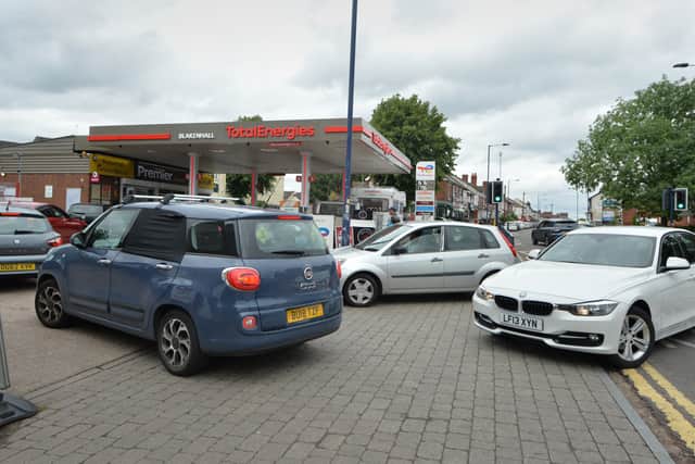 People queue to buy fuel at reduced price, at TotalEnergies Blakenhall Service Station, Dudley Road, Wolverhampton