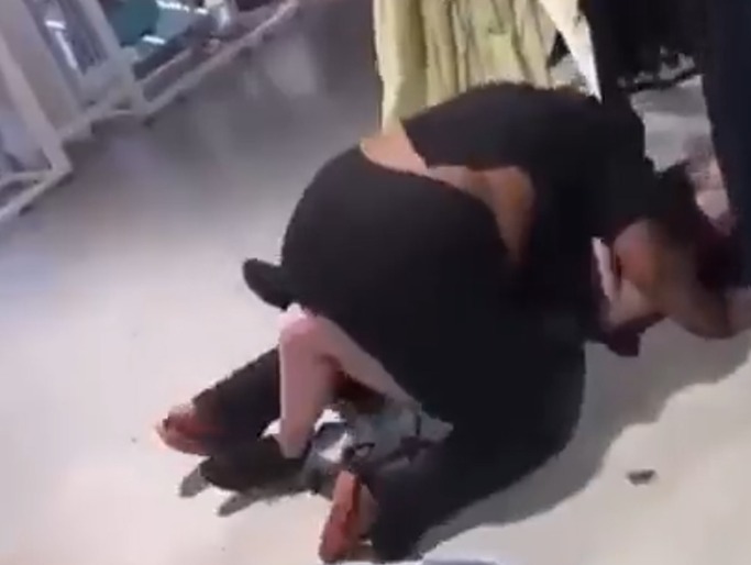 Two women trade blows and roll on floor in vicious Primark brawl