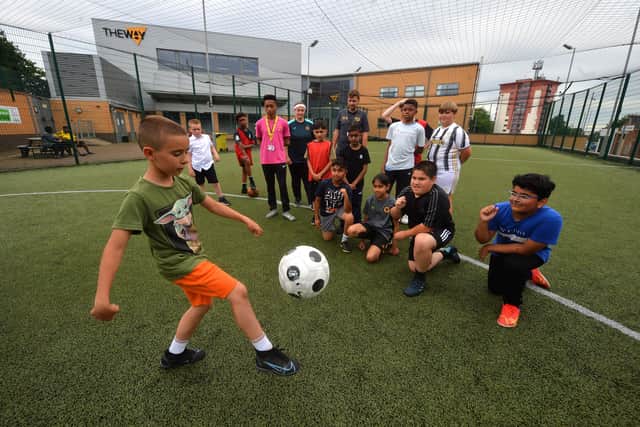 Peter Zangov, aged 10, shows off his his skills and to youth workers Sarlotte Ose, Louis Guttridge and Liam Gordon.