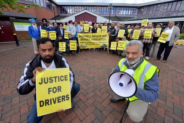 Mohammad Niwaz and Mohammed Ramzan lead the protest outside Sandwell Council house