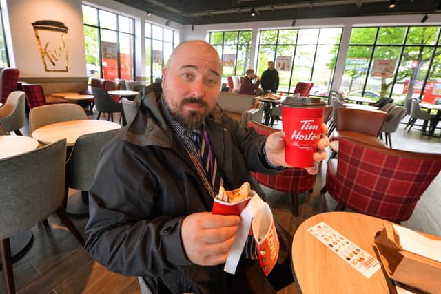 Express and Star reporter James Vukmirovic enjoys a breakfast wrap and dark roast coffee at the new Tim Hortons in Oldbury