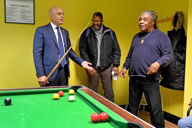 Sajid Javid joins members of the service at the African Caribbean Community Initiative in a game of pool