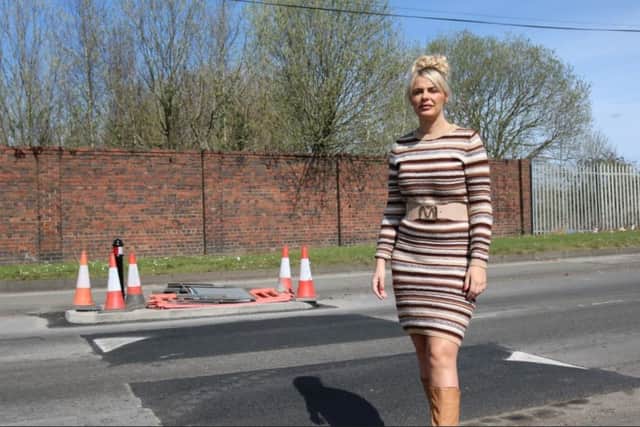 Councillor Beverley Momenabadi next to the speed bumps she spent three years campaigning for in Dixon Street