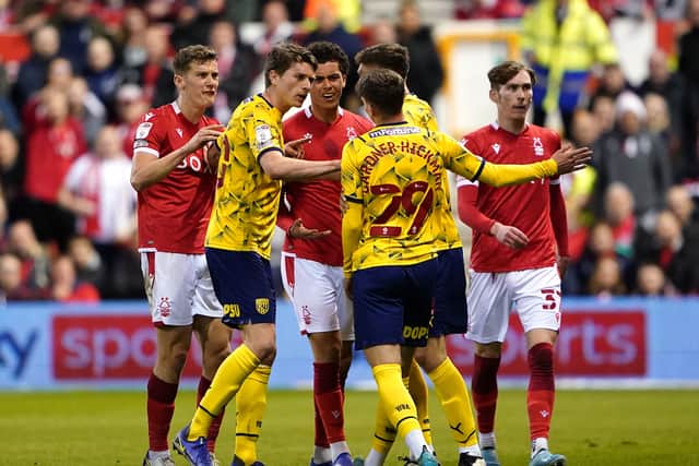 Players speak to West Bromwich Albion's Taylor Gardner-Hickman for kicking the ball into the crowd during the Sky Bet Championship match at the City Ground, Nottingham. Picture date: Monday April 18, 2022. PA Photo. See PA story SOCCER Forest. Photo credit should read: Zac Goodwin/PA Wire...RESTRICTIONS: EDITORIAL USE ONLY No use with unauthorised audio, video, data, fixture lists, club/league logos or "live" services. Online in-match use limited to 120 images, no video emulation. No use in betting, games or single club/league/player publications..