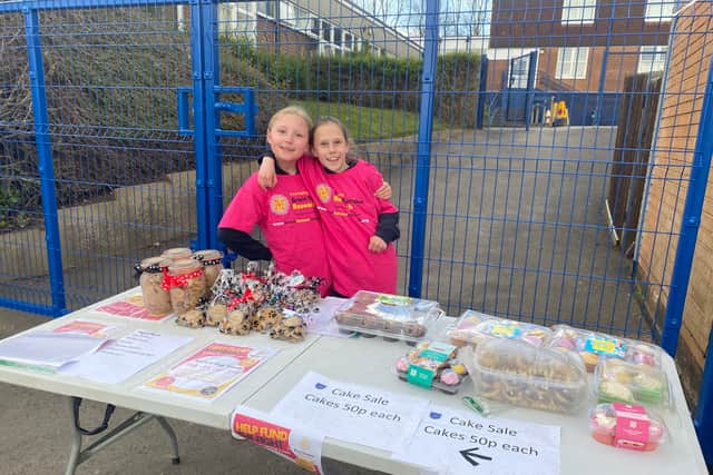Annabelle and Rosie at their fundraising stall on April 1