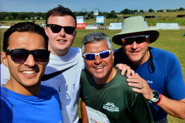 Suresh with son Arran Bawa, and friends Tom Hatton and Neil Taylor, during the 2016 sponsored walk