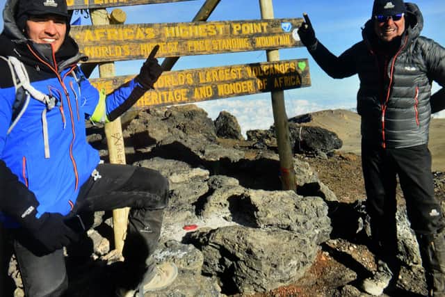 Suresh Bawa at the top of Kilimanjaro with son Arran