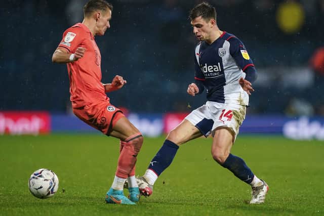 Swansea City's Hannes Wolf and West Bromwich Albion's Jayson Molumby 
