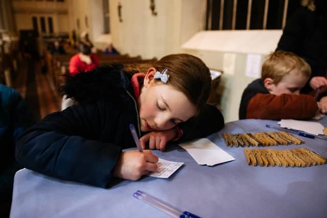 Another child writes a message