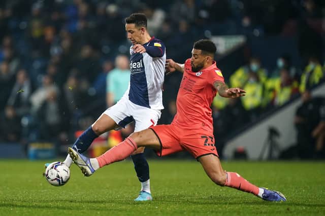 West Bromwich Albion's Callum Robinson and Swansea City's Cyrus Christie 