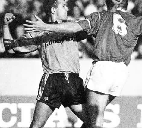 Bully and Walsh comes to blows in one of their legendary exchanges (pic Alamy)