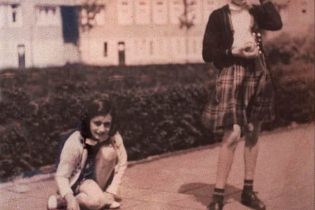 Anne Frank and childhood friend Hannah Goslar Pick, right, are seen in this undated photo from pre-World War Two in Amsterdam during a game of hopscotch