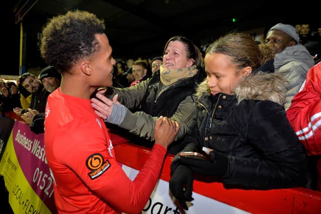 Elliot Bonds gets a hug off Mom