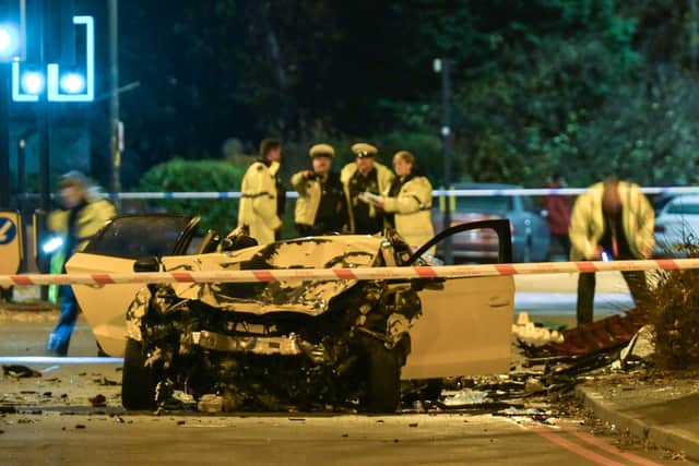 Firefighters cut the roof off the Audi to get one of the injured passengers out. Photo: SnapperSK