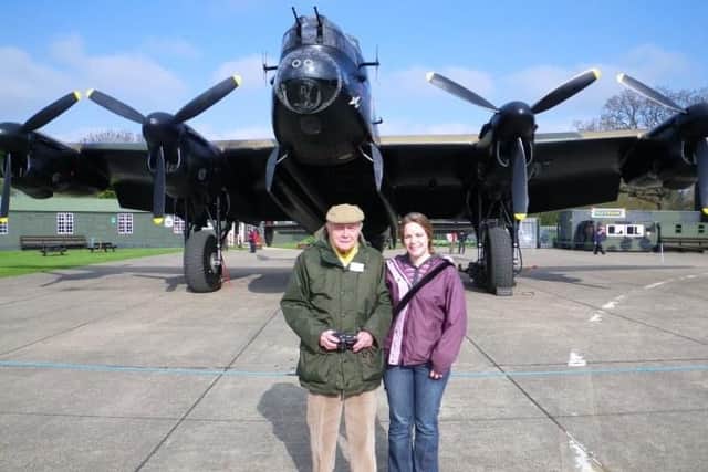 Wilfred Dawson and his granddaughter Susie Phillips in front of a Lancaster at a museum in East Kirkby