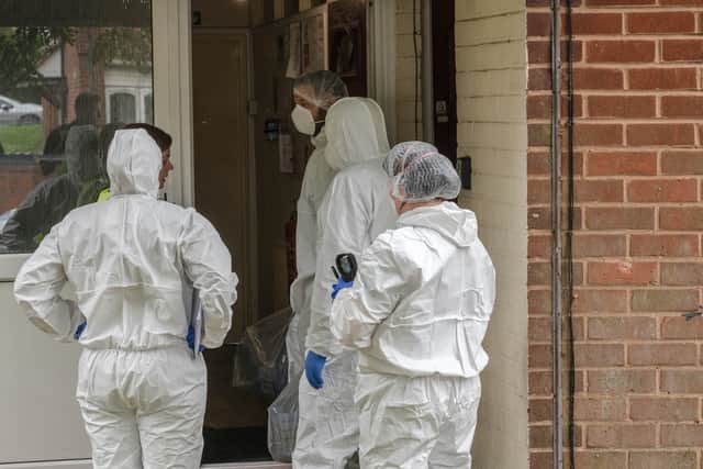Forensic officers at the scene in Unett Street. Photo: SnapperSK