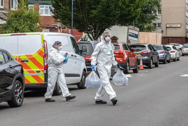 Forensic officers at the scene in Unett Street. Photo: SnapperSK