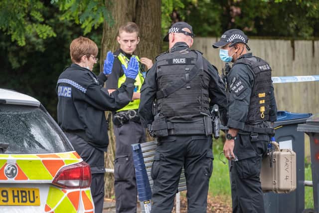 Armed police at the scene in Unett Street. Photo: SnapperSK