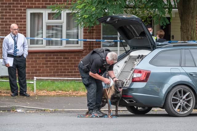 Police at the scene in Unett Street. Photo: SnapperSK