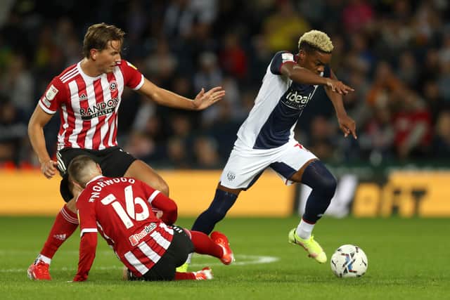 Grady Diangana of West Bromwich Albion best away from Sander Berge of Sheffield United  and Oliver Norwood of Sheffield United. (AMA)