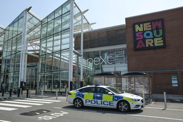 Police outside New Square Shopping Centre after two officers were attacked. Photo: SnapperSK